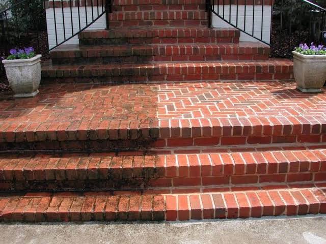 Brick steps restored to their original color by power washing